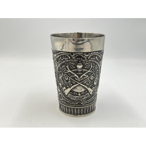 2054 - A vintage West German embossed pewter beaker - approx. 11cm high x 7.5cm diameter