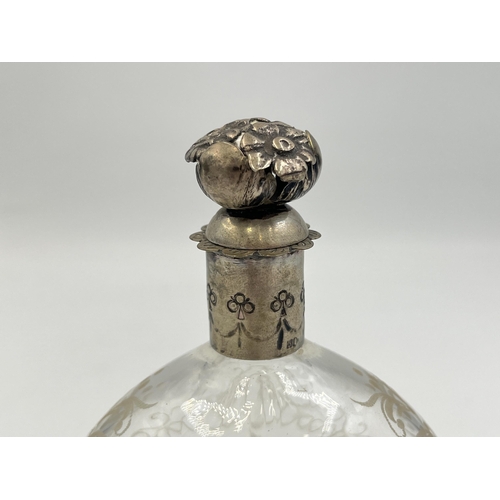 2055 - An antique continental etched glass scent bottle with .800 silver top - approx. 13cm high