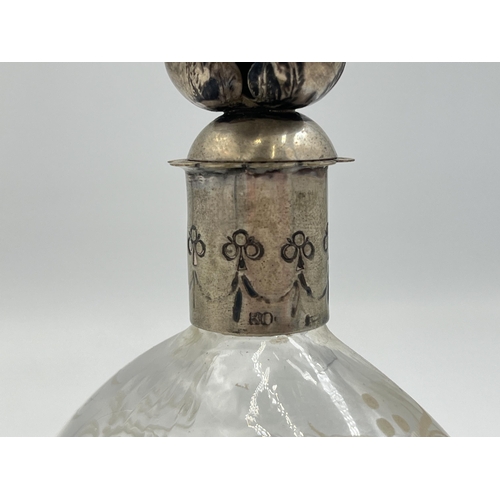 2055 - An antique continental etched glass scent bottle with .800 silver top - approx. 13cm high