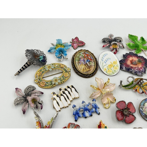 2057 - A collection of brooches to include Catherine Popesco France, sterling silver and enamel etc.