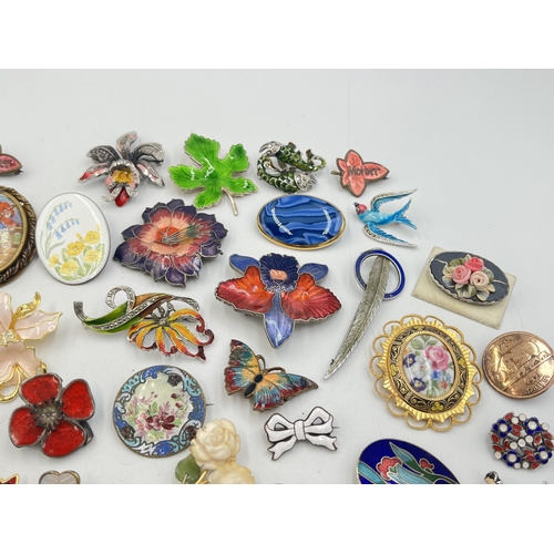 2057 - A collection of brooches to include Catherine Popesco France, sterling silver and enamel etc.