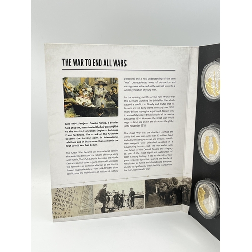 2084 - An In Flanders Fields Museum 'We Will Remember Them' eight coin set which includes 2018 9ct gold pro... 