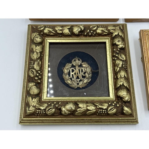 2093 - Four framed military cap badges