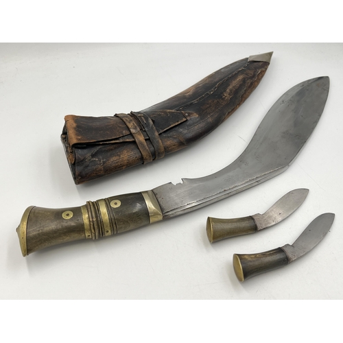 2095 - A Kukri knife with throwing knives and leather scabbard