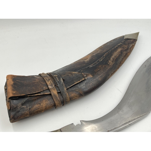 2095 - A Kukri knife with throwing knives and leather scabbard