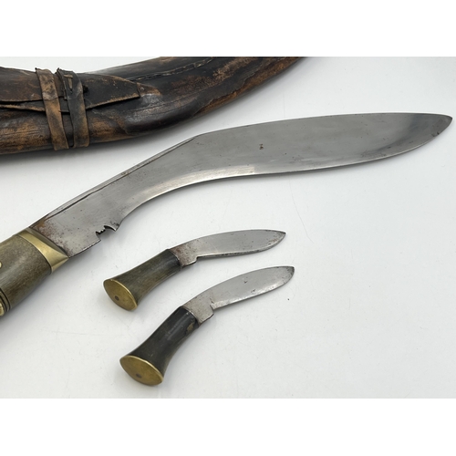 2095 - A Kukri knife with throwing knives and leather scabbard