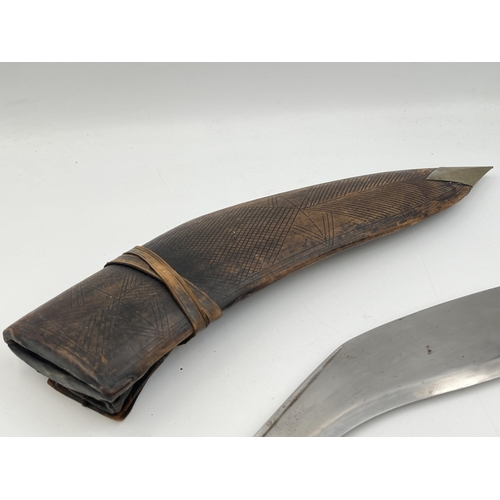 2095 - A Kukri knife with throwing knives and leather scabbard