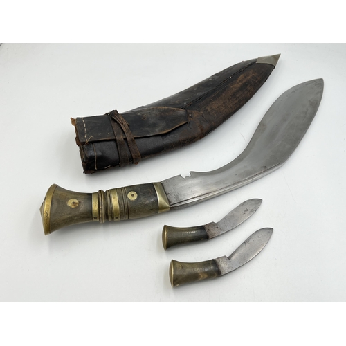 2096 - A Kukri knife with throwing knives and leather scabbard