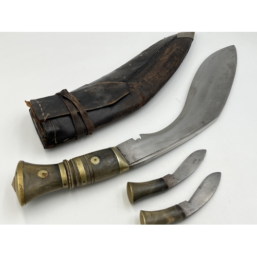 2096 - A Kukri knife with throwing knives and leather scabbard