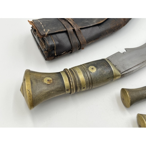 2096 - A Kukri knife with throwing knives and leather scabbard