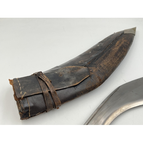 2096 - A Kukri knife with throwing knives and leather scabbard