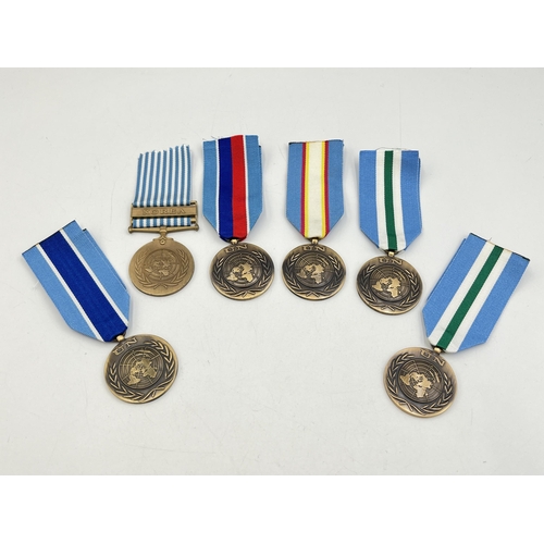 2098 - Six United Nations Service medals to include one with Korea clasp etc.