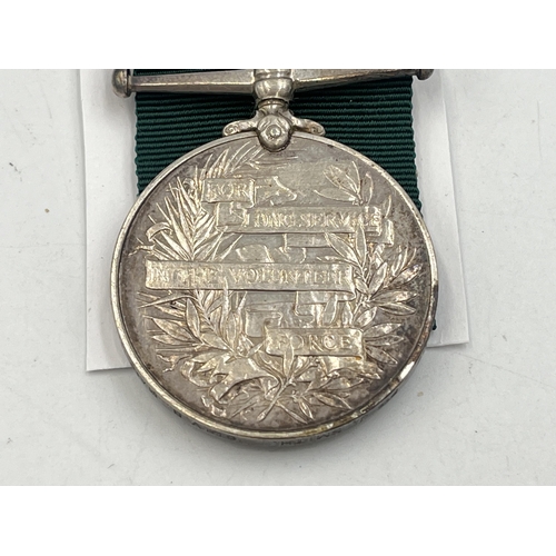 2103 - A Long Service Volunteer Force medal presented to 2497 Pte. J. Smith. 6th V.B. Manch. Regt.