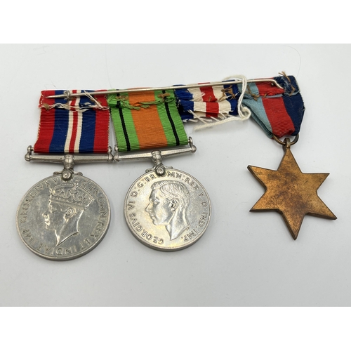 2138 - Three WWII British medals, one Defence, one War and one The 1939-1945 Star