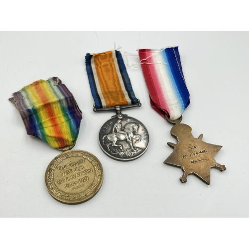 2140 - A WWI British medal trio presented to 275505 Pte. F. T. Sharp Manch. R.