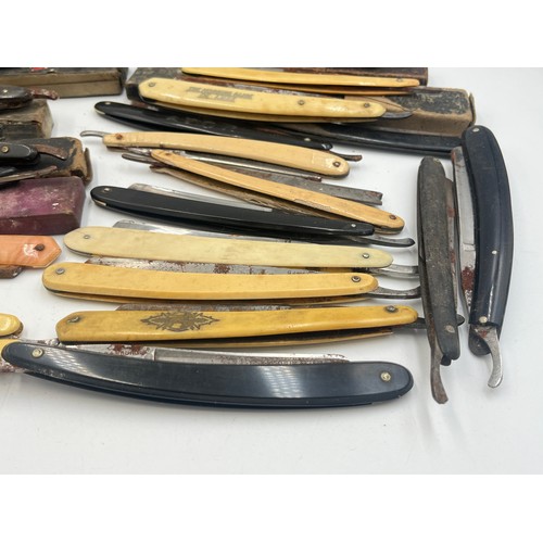 2067B - A collection of late 19th/early 20th century cut throat razors to include Ator, A. Schnittert Wald-S... 