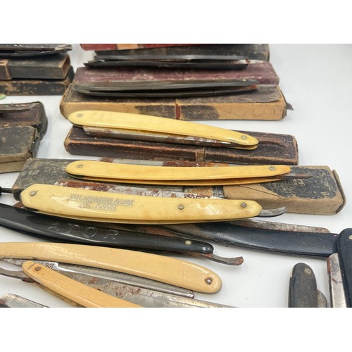 2067B - A collection of late 19th/early 20th century cut throat razors to include Ator, A. Schnittert Wald-S... 