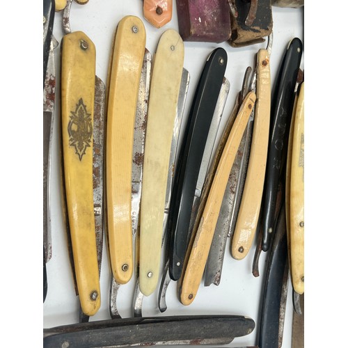 2067B - A collection of late 19th/early 20th century cut throat razors to include Ator, A. Schnittert Wald-S... 