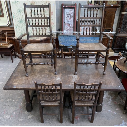 68 - A 17th century style solid oak refectory table and six Lancashire style elm and rush seated dining c... 