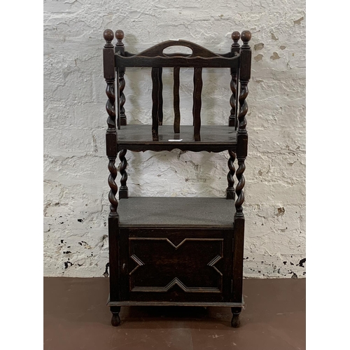 91 - An early 20th century carved oak barley twist magazine rack side cabinet - approx. 83cm high x 38cm ... 