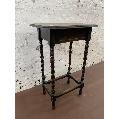 93 - An early 20th century oak barley twist side table - approx. 62cm high x 40cm wide x 30cm deep