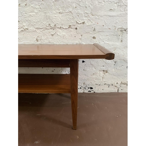 95 - A mid 20th century Myer teak two tier coffee table - approx. 36cm high x 38cm wide x 113cm long