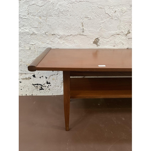 95 - A mid 20th century Myer teak two tier coffee table - approx. 36cm high x 38cm wide x 113cm long