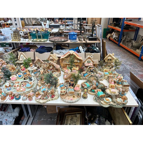 518 - An extensive collection of Pendelfin rabbit figurines and display stands to include Daisy Duck, Coll... 