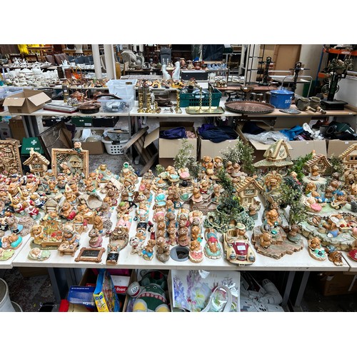 518 - An extensive collection of Pendelfin rabbit figurines and display stands to include Daisy Duck, Coll... 