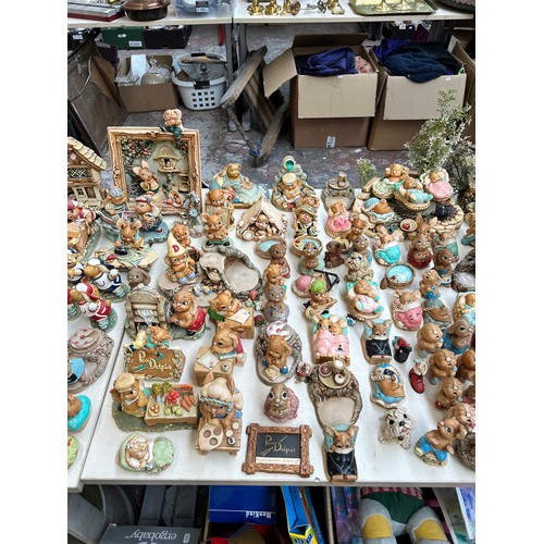 518 - An extensive collection of Pendelfin rabbit figurines and display stands to include Daisy Duck, Coll... 