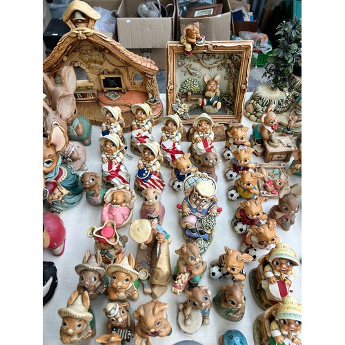 518 - An extensive collection of Pendelfin rabbit figurines and display stands to include Daisy Duck, Coll... 