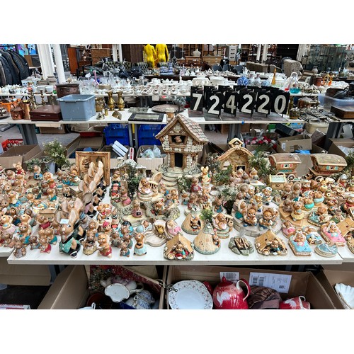 518 - An extensive collection of Pendelfin rabbit figurines and display stands to include Daisy Duck, Coll... 