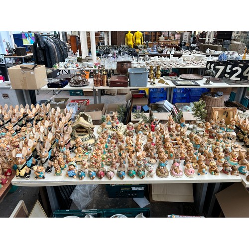 518 - An extensive collection of Pendelfin rabbit figurines and display stands to include Daisy Duck, Coll... 