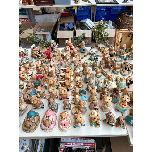 518 - An extensive collection of Pendelfin rabbit figurines and display stands to include Daisy Duck, Coll... 