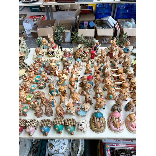 518 - An extensive collection of Pendelfin rabbit figurines and display stands to include Daisy Duck, Coll... 