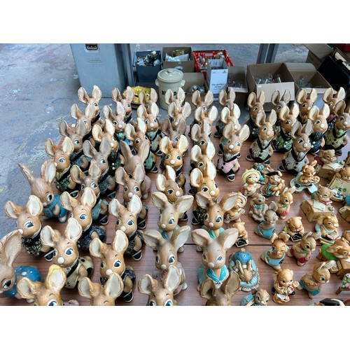 518 - An extensive collection of Pendelfin rabbit figurines and display stands to include Daisy Duck, Coll... 