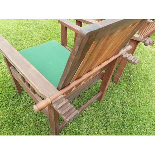 250A - A pair of teak reclining garden armchairs - approx. 93cm high x 65cm wide x 80cm deep