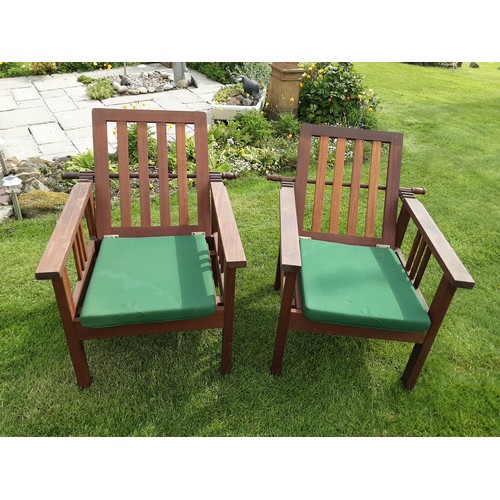 250A - A pair of teak reclining garden armchairs - approx. 93cm high x 65cm wide x 80cm deep