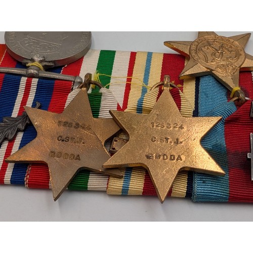 2165 - A WWII seven piece medal group presented to 126324V C. St. John Rodda comprising Military Cross insc... 