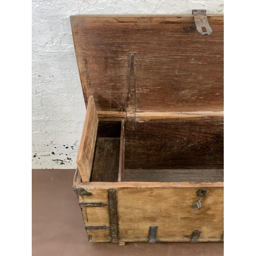 6 - A 19th century teak and iron banded chest - approx. 57cm high x 104cm wide x 47cm deep