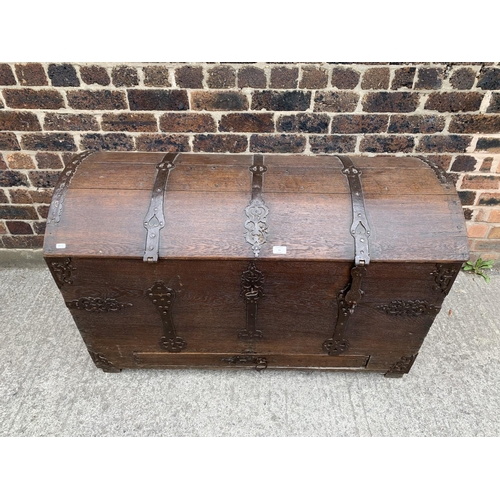 9 - A large 18th century German oak and metal banded dome top seaman's chest with lower drawer - approx.... 