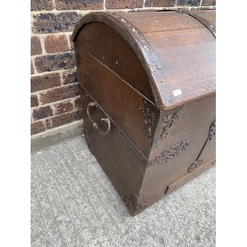 9 - A large 18th century German oak and metal banded dome top seaman's chest with lower drawer - approx.... 