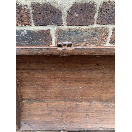 9 - A large 18th century German oak and metal banded dome top seaman's chest with lower drawer - approx.... 