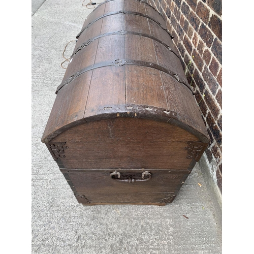 9 - A large 18th century German oak and metal banded dome top seaman's chest with lower drawer - approx.... 