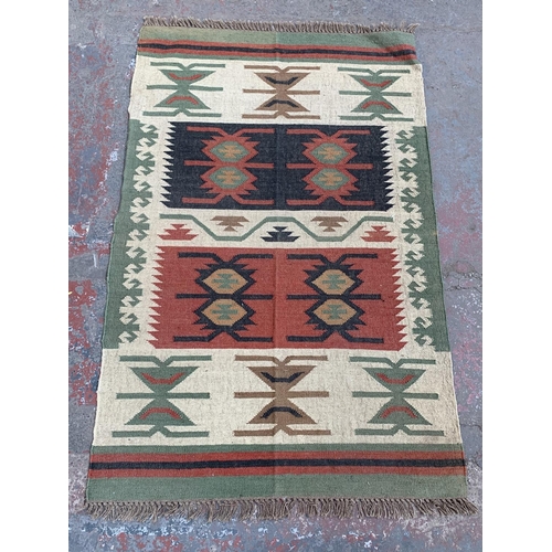 10 - A mid 20th century Kilim rug - approx. 198cm x 122cm