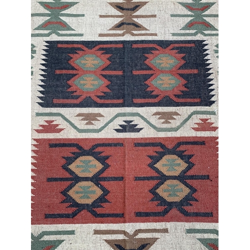 10 - A mid 20th century Kilim rug - approx. 198cm x 122cm