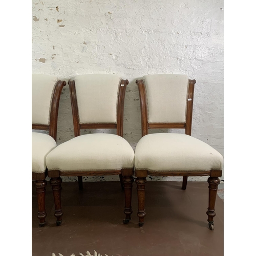 75 - Four 19th century oak and fabric upholstered dining chairs on castors