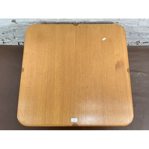 94 - A mid 20th century teak square coffee table - approx. 43cm high x 75cm square