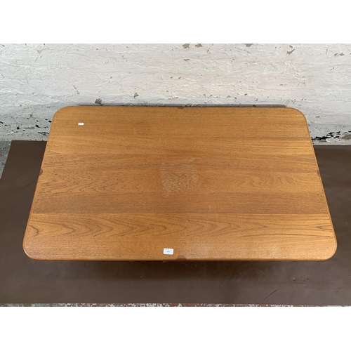 95 - A mid 20th century teak rectangular coffee table - approx. 42cm high x 75cm wide x 125cm long