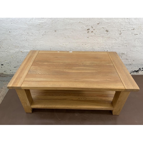 97 - A modern solid oak rectangular two tier coffee table - approx. 50cm high x 70cm wide x 120cm long